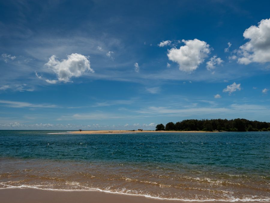 Still, shallow turquoise water under a clear sky on Sri Lanka's eastern shore