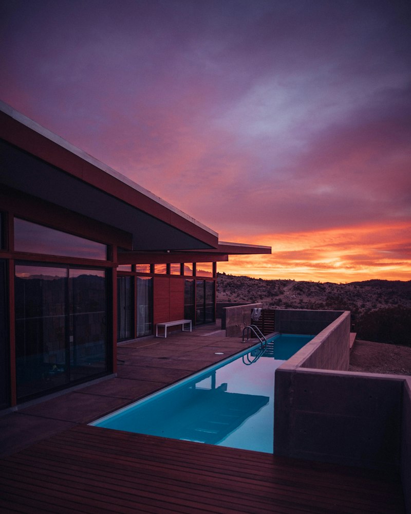 A luxury boutique villa terrace overlooking tropical gardens