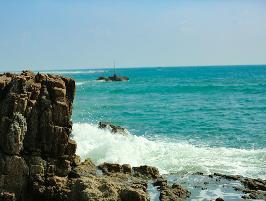 An empty white-sand bay with still turquoise water on Sri Lanka's east coast